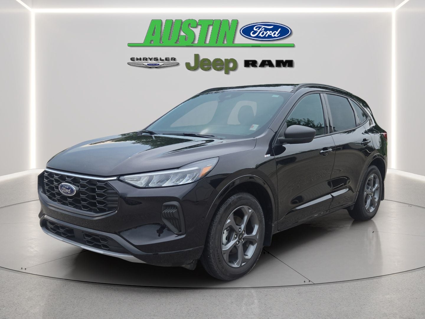 2024 Ford Escape ST-Line in Black Metallic — front three-quarter view
